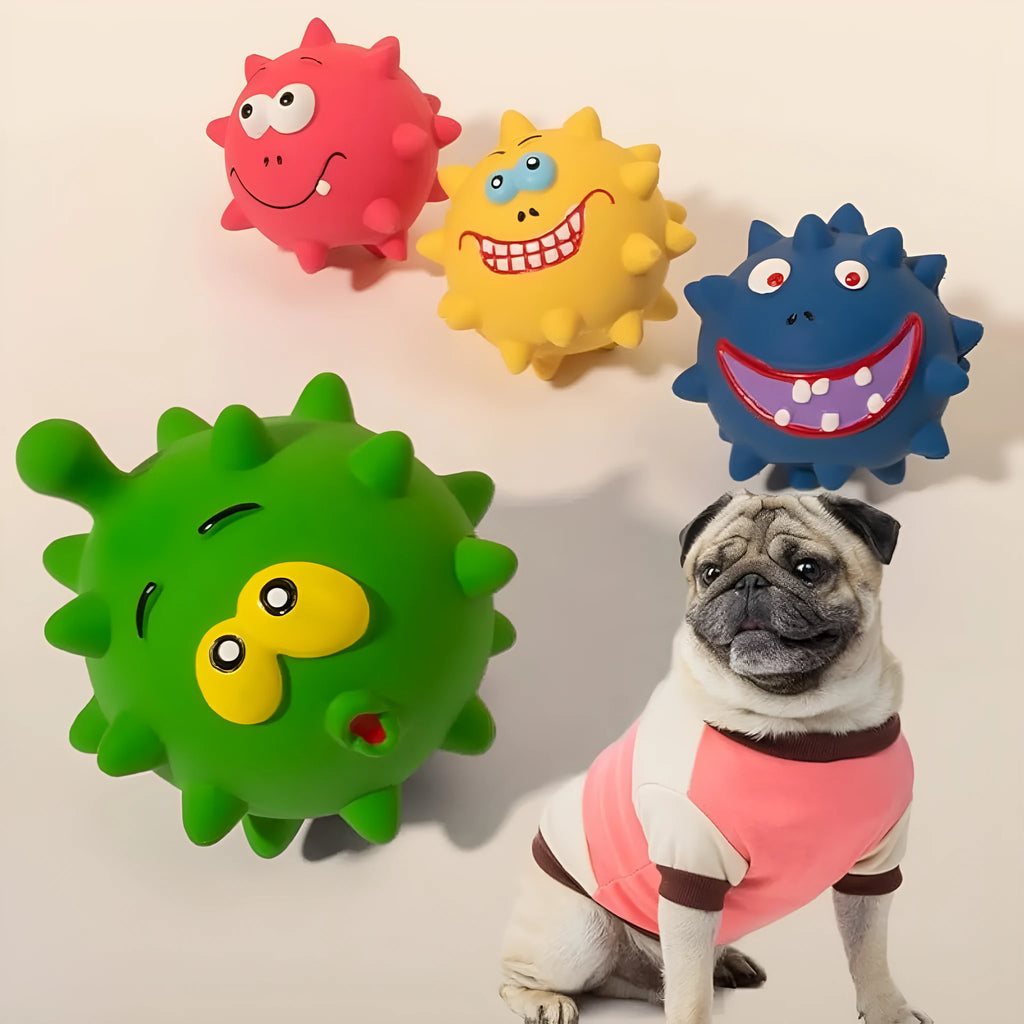 Colourful natural latex squeaky dog ball with cute face and textured surface for teeth cleaning.