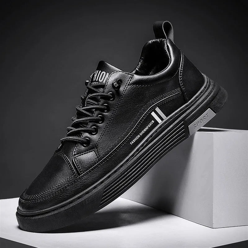 Men's low-top black and white skateboard shoes with elastic band closure and rubber sole