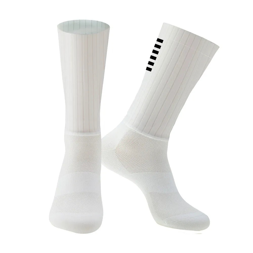 Cycling and running socks in chemical fibre blend fabric shown in orange, black, purple, white, grey, and dark blue colours.