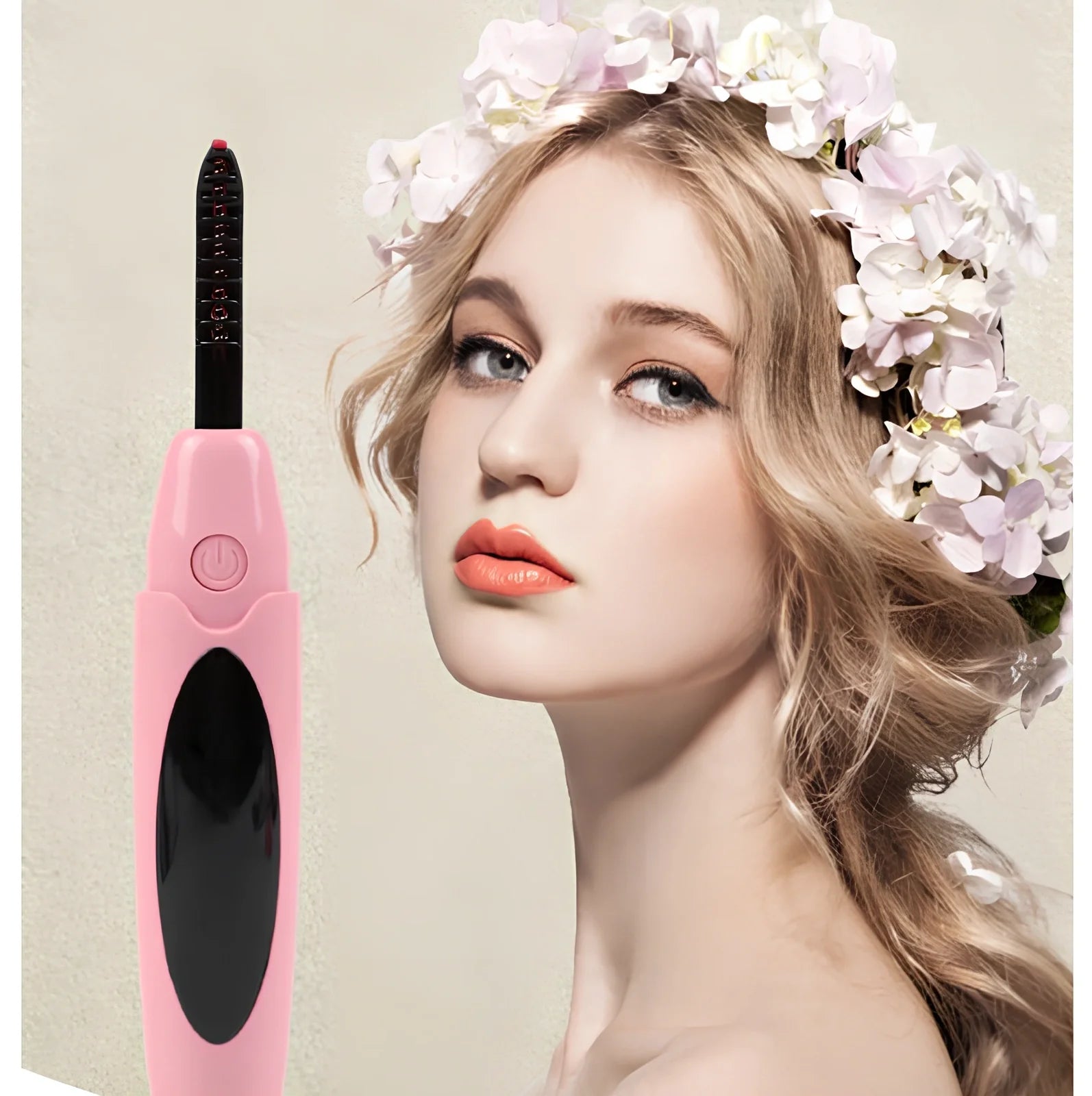 Pink USB-charged electric eyelash curler with curved brush head and LED indicator