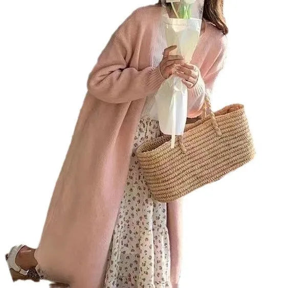 Women's khaki loose-fit knitted V-neck cardigan on a hanger, showing mid-length and long sleeves.