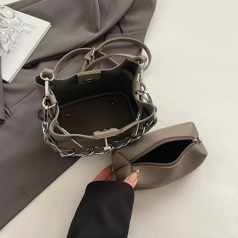 Soft PU leather retro bucket shoulder bag with chain detail in four colour options.