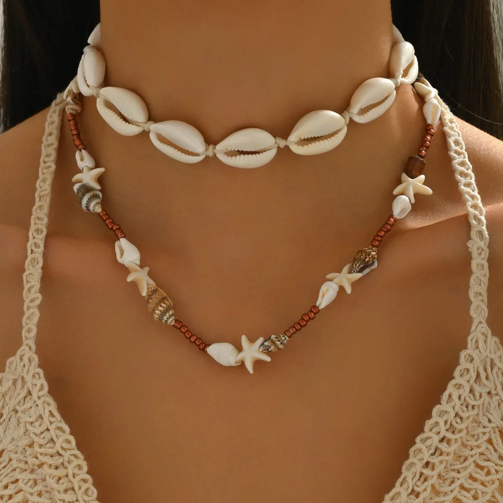 Geometric seashell pendant necklace on regular chain, colour X1900