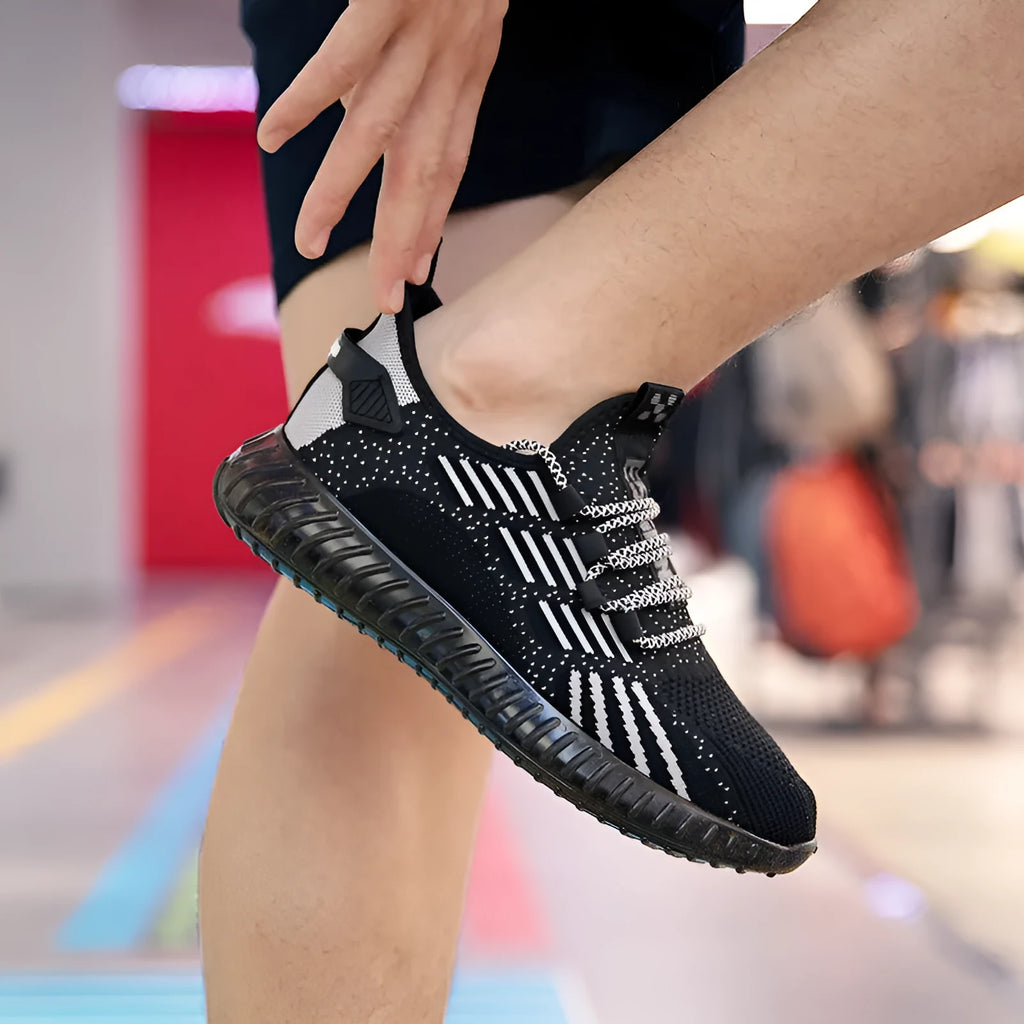 Men's breathable flying fabric sports shoes in black, white and khaki with mesh construction