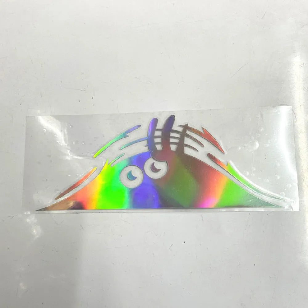 Large rectangular self-adhesive body sticker on skin, showing colourful smiley face design measuring 19cm by 7cm.