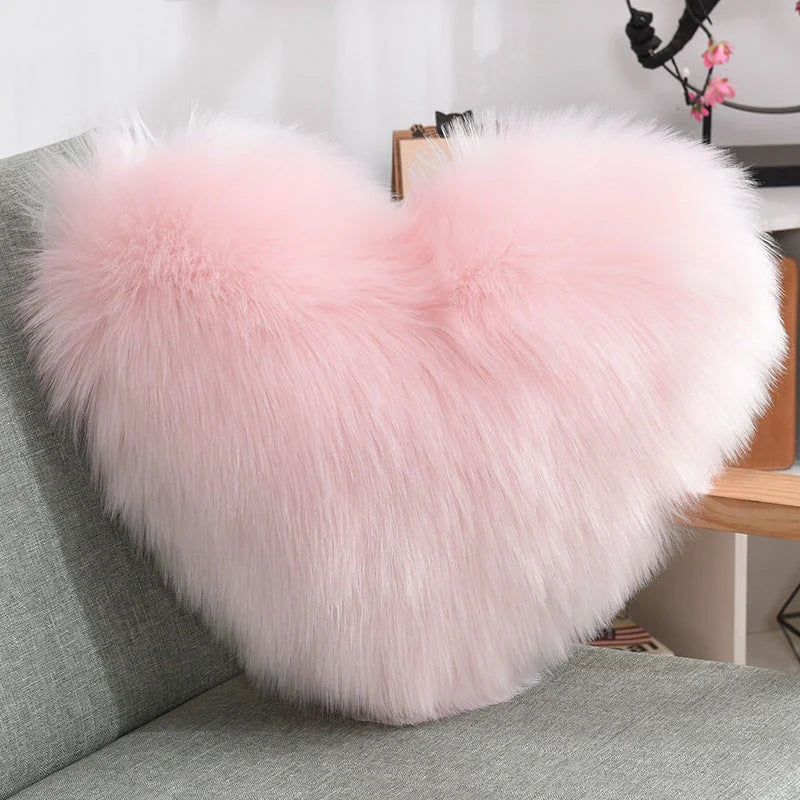 Plush heart-shaped throw pillows in various colors and styles for cozy sofa decor