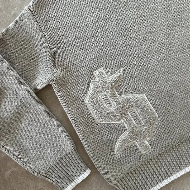 Grey jacquard knit pullover coat with loose fit and long sleeves for autumn winter wear