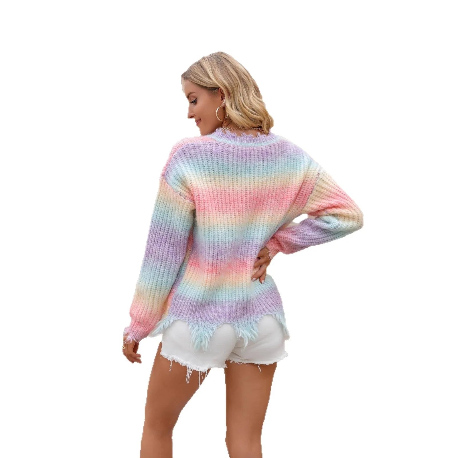 Pink rainbow gradient loose knit sweater with tassel details on hanger