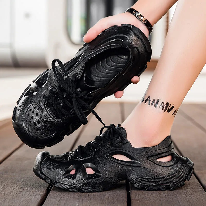 Men's black lace-up sports sandals with an EVA sole and round toe holder on an outdoor surface.