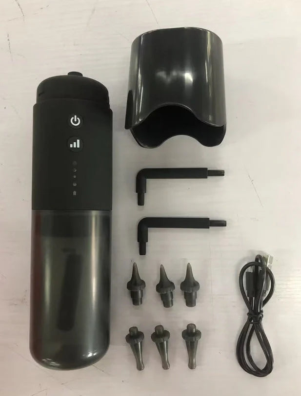 Black silicone ear washer with three nozzles and USB cable on white background