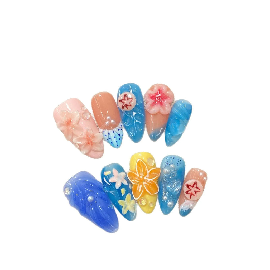 Three-dimensional carved jellyfish marine style plastic wearable armour in almond nail colour with rose, tulip, and XINGX patterns