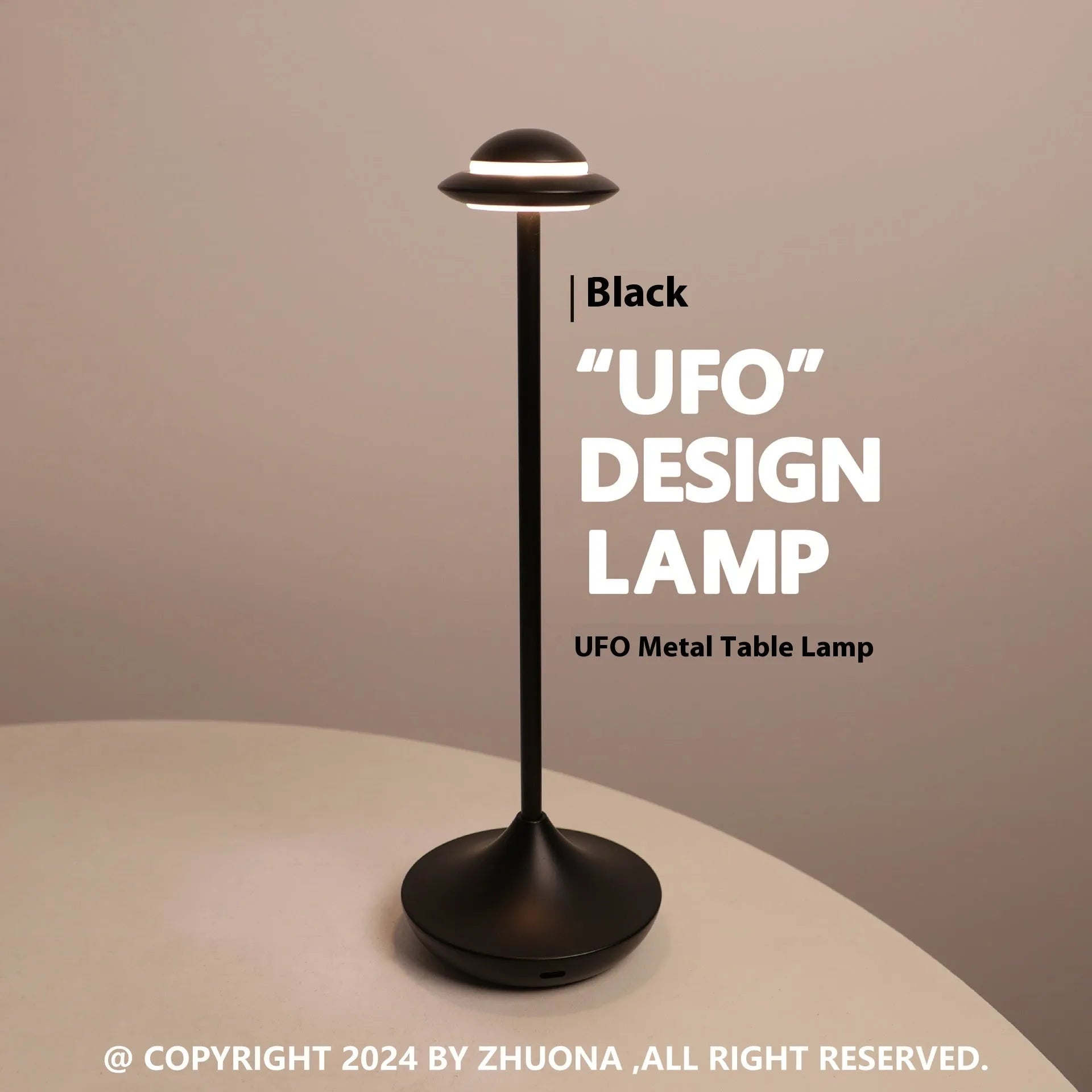 Metallic UFO-shaped rechargeable table lamp with touch controls in black finish on a wooden desk.