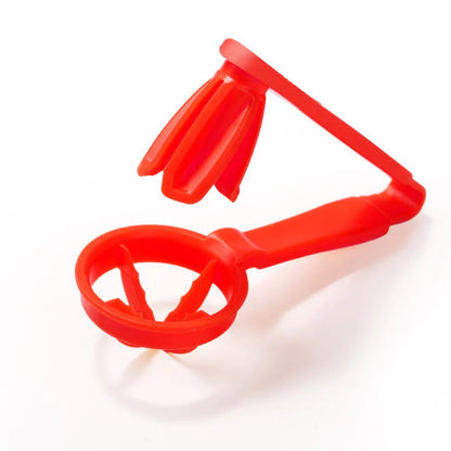Manual tomato slicer with serrated knife for even dicing, available in red and yellow