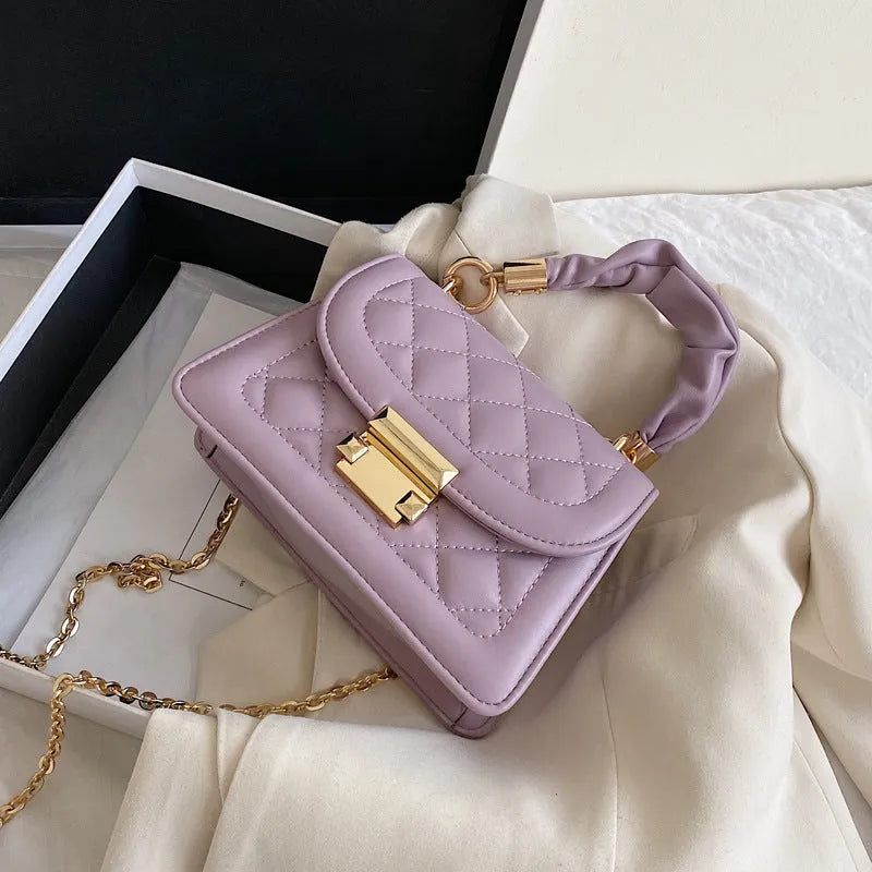 Women's purple rhombus square shoulder bag with crossbody strap showing structured design