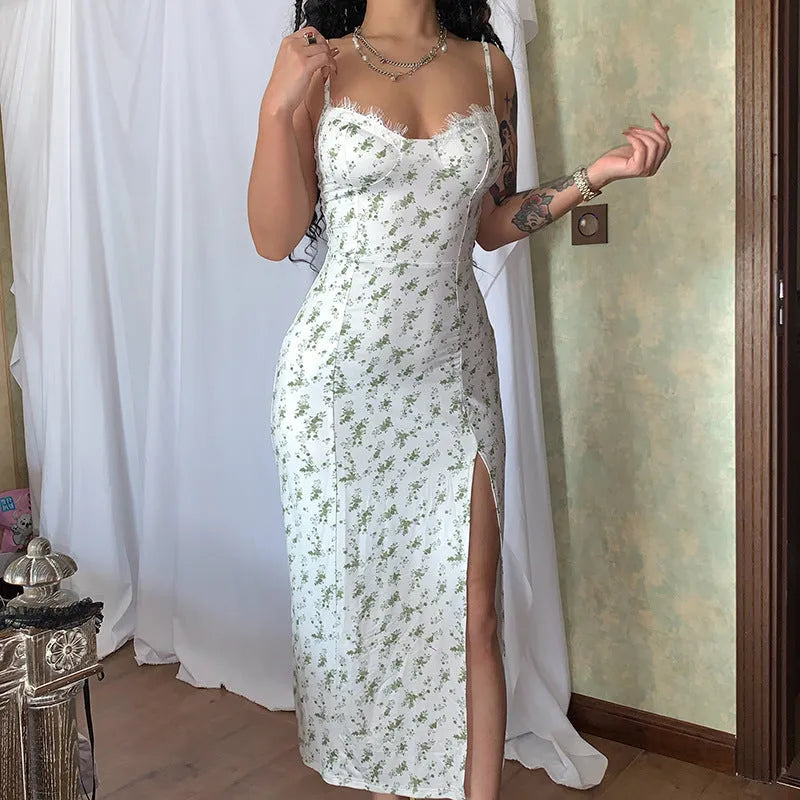 Women's floral lace print long dress with suspender straps and a thigh slit, shown in blue.