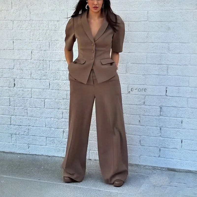 Brown men's slim fit polyester suit set comprising a long-sleeve top and matching trousers on a hanger.