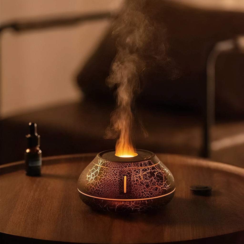 Round resin aroma diffuser with colourful flame effect lighting on desktop