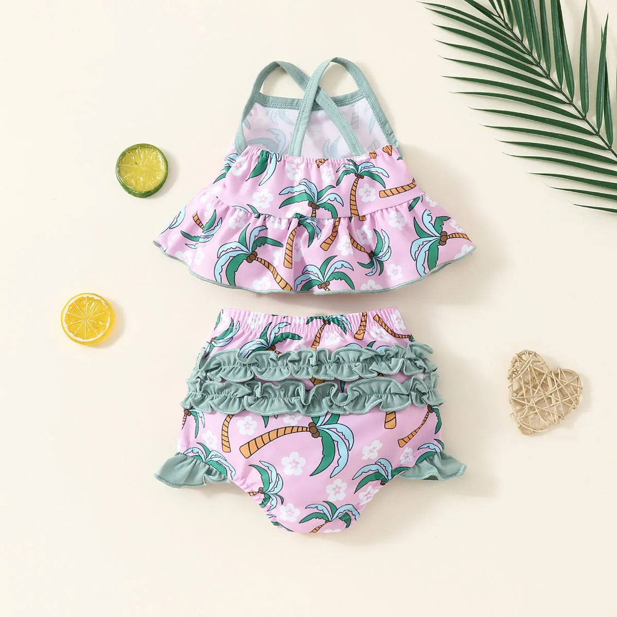White polyester two-piece swimsuit set for girls with shirt top and shorts.