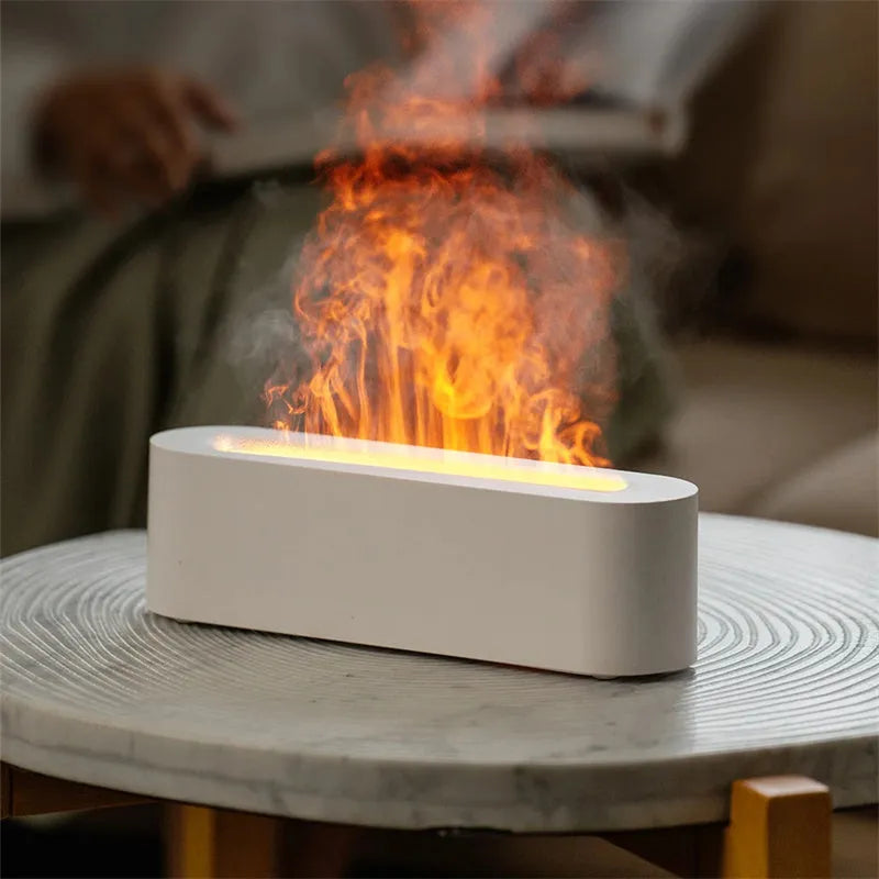White square ultrasonic flame aroma diffuser with LED lights on a wooden table.