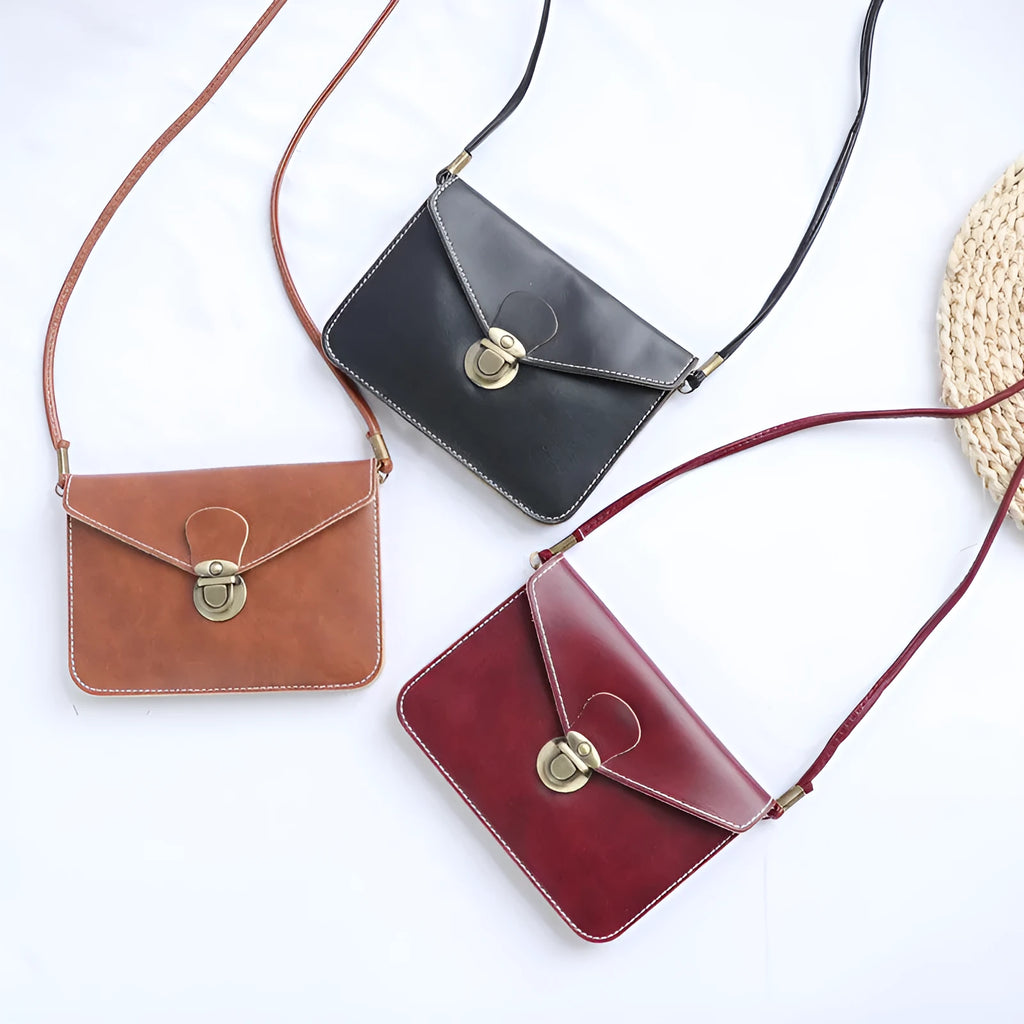 Retro soft surface messenger bag with crossbody strap and secure lock closure
