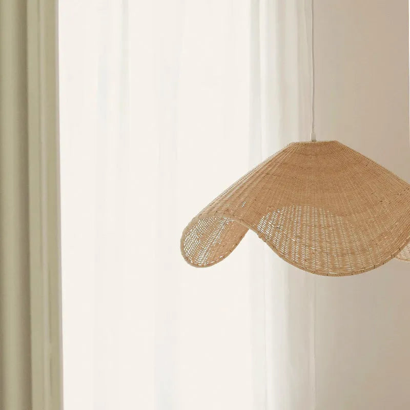 Handmade bamboo and straw rattan chandelier with warm LED light in natural woven design