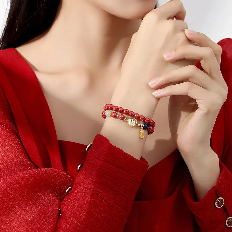S925 sterling silver cinnabar bracelet for women with a 6mm white shell blessing charm.