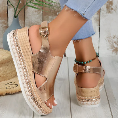 Women's gold fish mouth buckle wedges with hollow sides and 7 cm rubber heel on white background