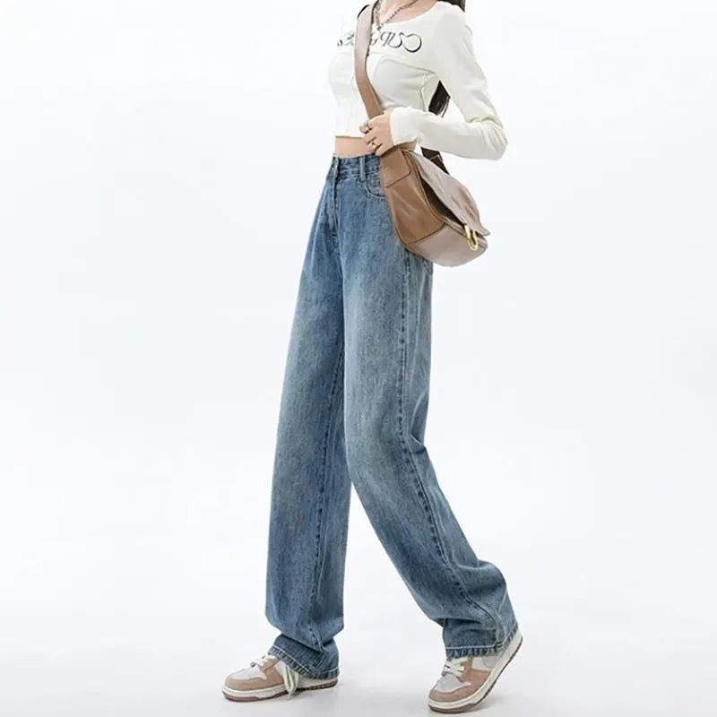 Woman wearing retro blue high waist wide leg jeans with a straight cut