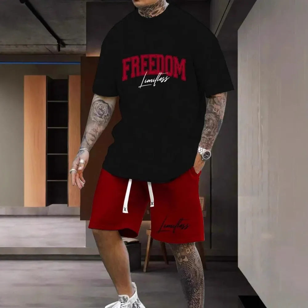 Man wearing a grey short sleeve top and matching shorts with a 3D printed white letter design.