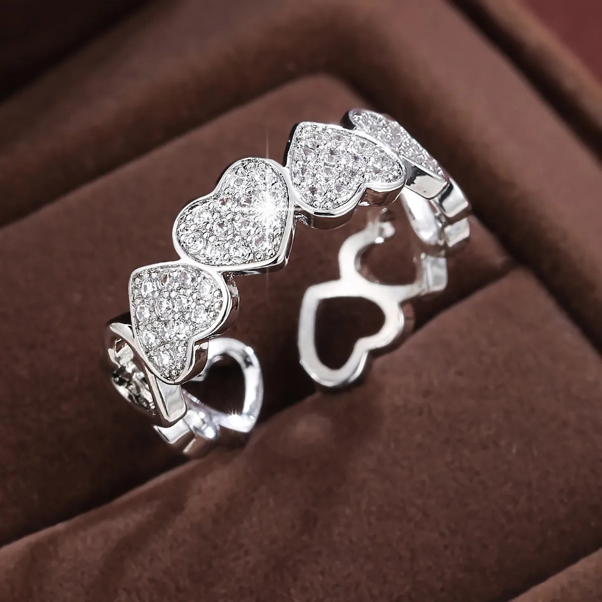 Adjustable geometric copper couple ring with love heart detail in gold or silver colour.