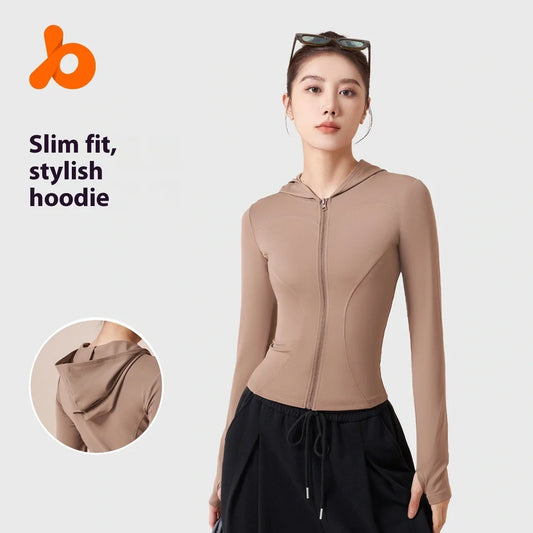 Women's slim fit hooded yoga jacket in sauce tomato purple colour showing windproof polyester fabric and spandex lining for flexibility