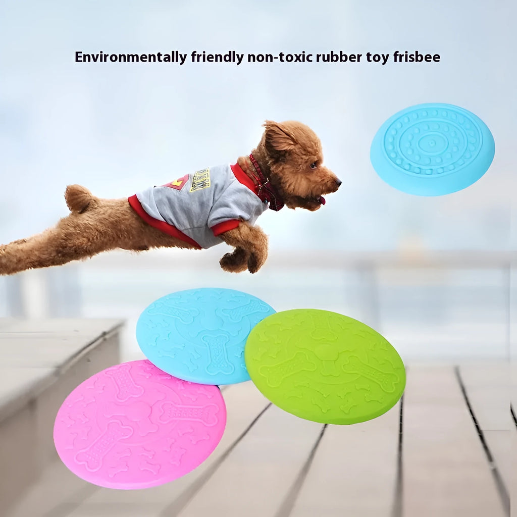 Rubber dog frisbee toy in green colour, showing soft plastic construction suitable for throwing and catching games with pets