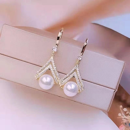 Water Drop Pearl Earrings in gold, white, and champagne with geometric design