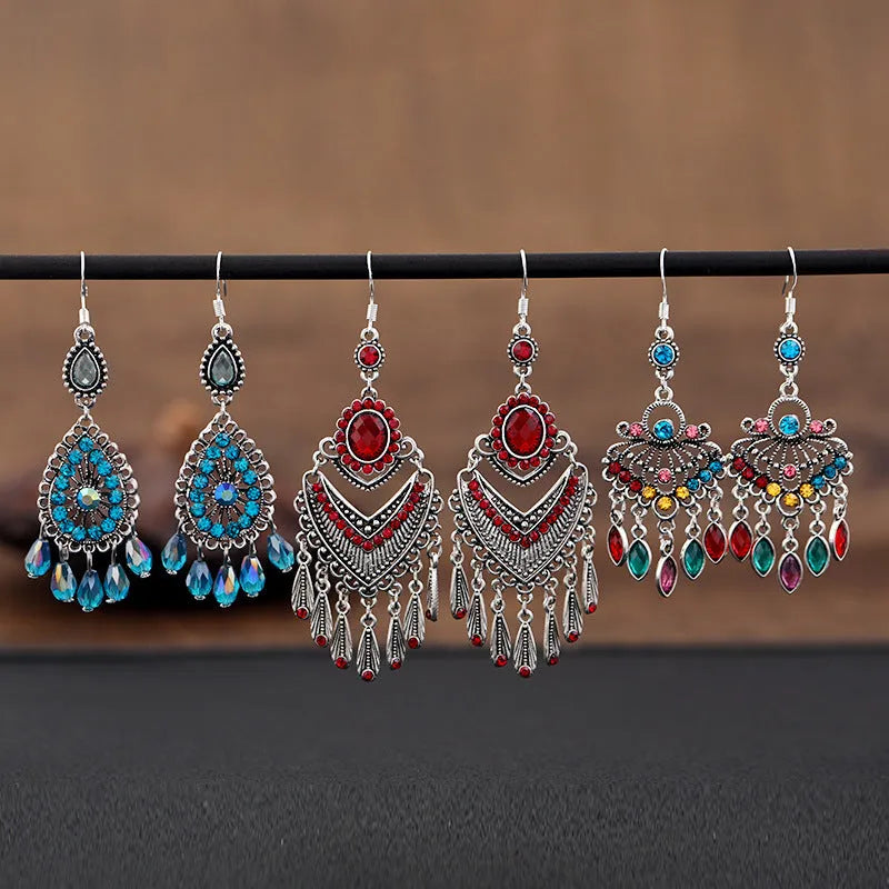 Purple water drop shaped retro earrings with long fringe detailing and ethnic style elements