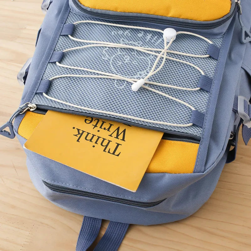 Lightweight large capacity student backpack in nylon, showing curved shoulder straps and solid colour options.
