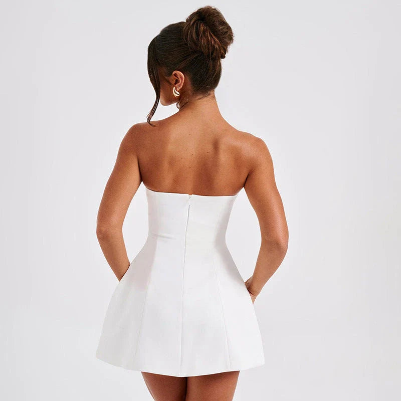 Stylish backless tube dress in a variety of colors, including black, white, and pink, showcasing a flattering A-line silhouette and premium construction.