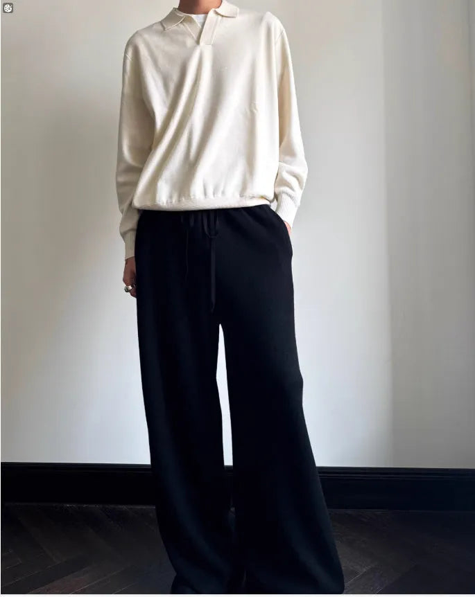 Pure wool polo sweater with a lapel collar in milky white, showing loose fit and long sleeves.