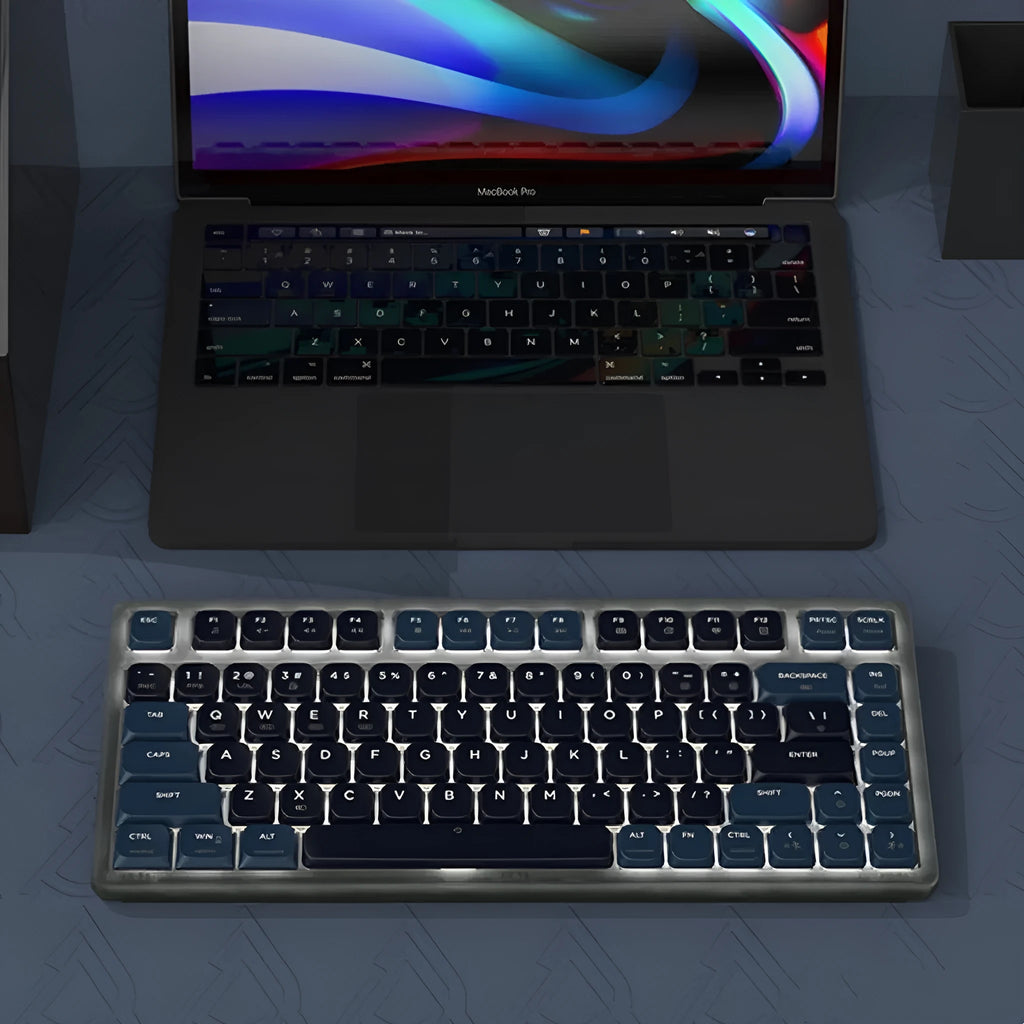Ajazz AK832PRO green or tea coloured compact mechanical keyboard with RGB backlighting on a desk.