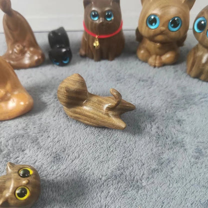 Handcrafted sandalwood kitten ornaments in various styles and colours