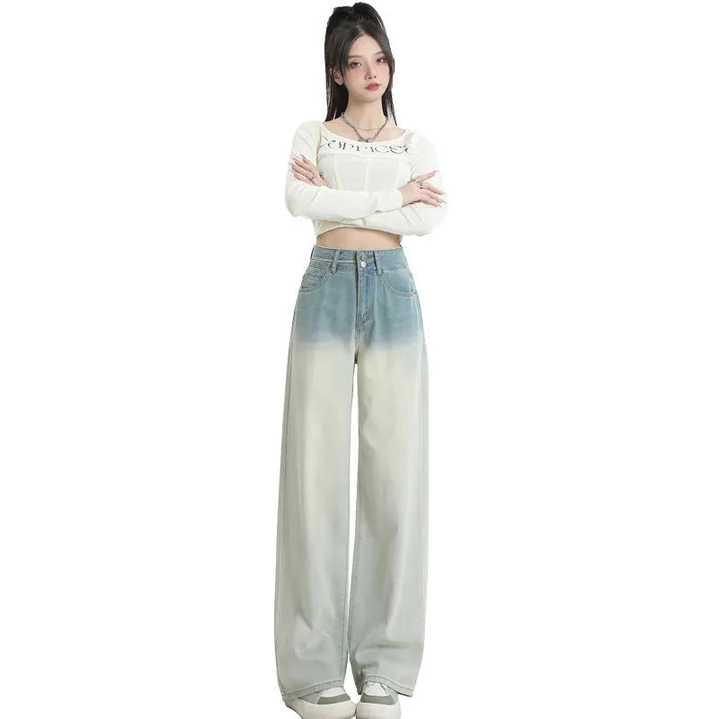 Women's gradient blue straight-leg wide leg cotton denim trousers laid flat.