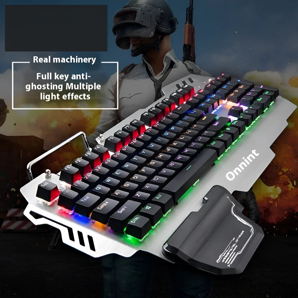 Silver gaming keyboard with green mechanical switches and wrist splint accessory on desktop