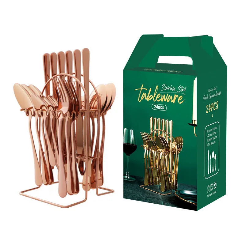 24-piece stainless steel cutlery set with storage rack in gold finish showing knives, forks, spoons
