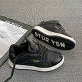 Men's black thick bottom board shoes with PU leather upper and rubber sole on a light background