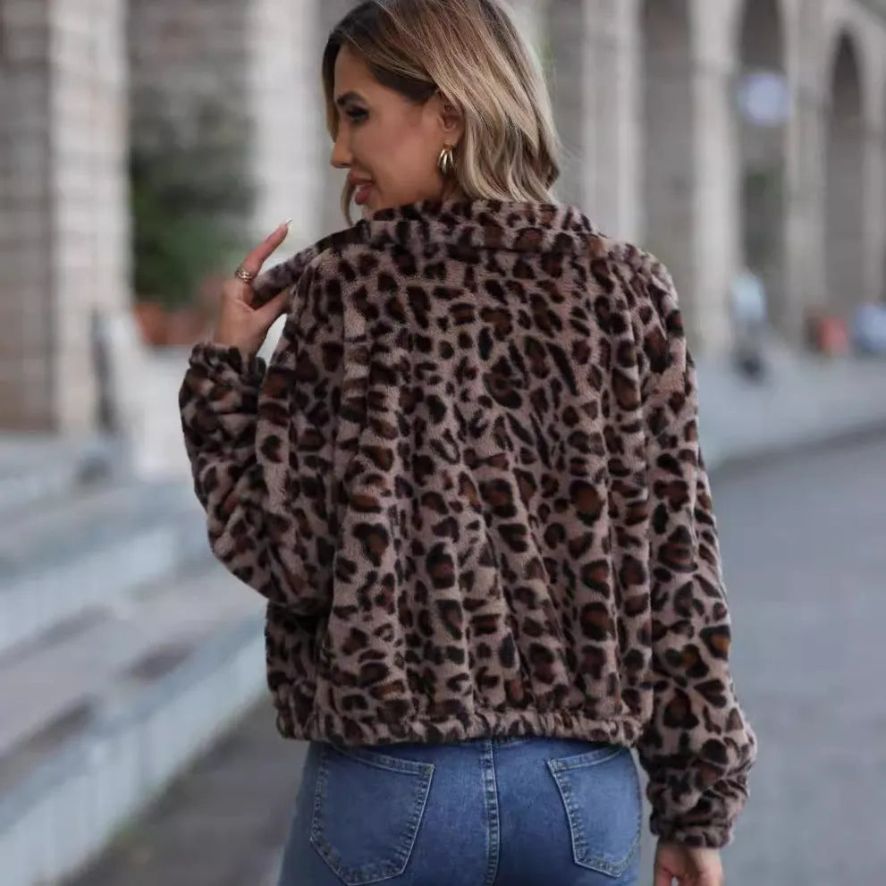 Women's loose fit leopard print plush coat with long raglan sleeves and a full zip.