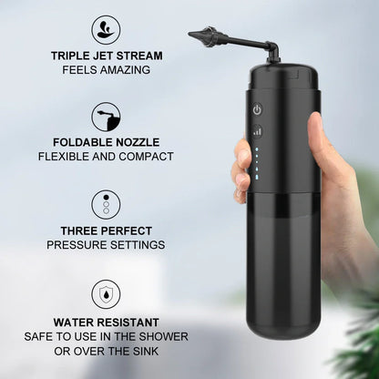 Black silicone ear washer with three nozzles and USB cable on white background