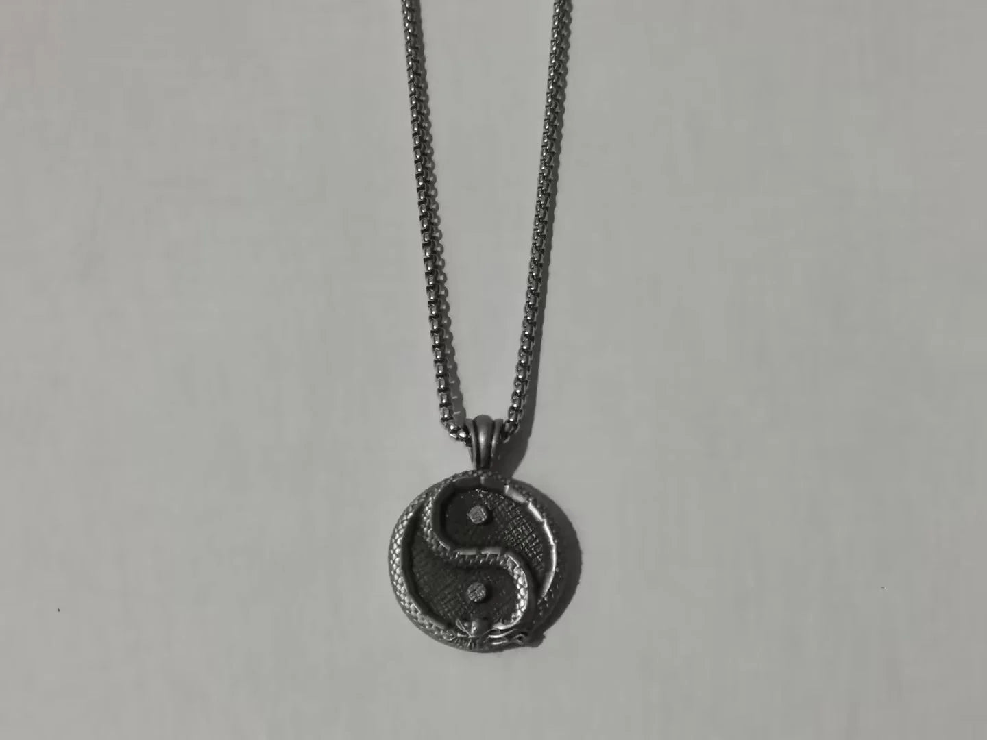 Men's black titanium steel pendant sweater chain with a polished finish