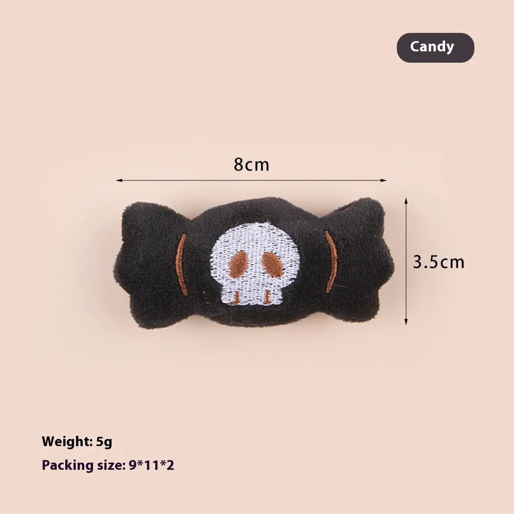 Small plush candy cat teaser wand on a stick in one of three colour designs: Eyes, Candy, or Skull.