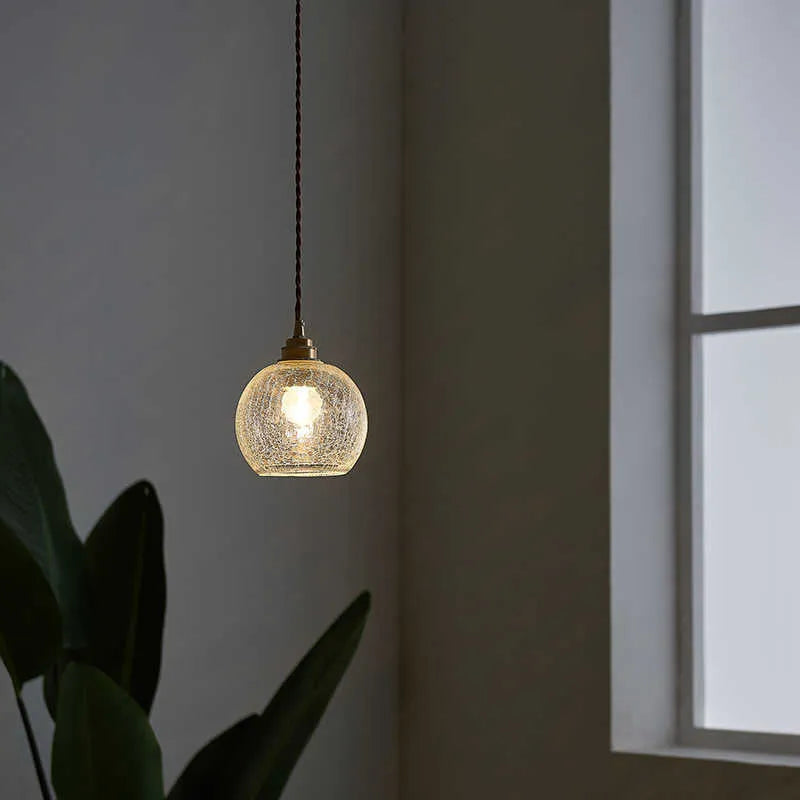 Retro style brass and glass ball chandelier with compact dimensions on a white background.