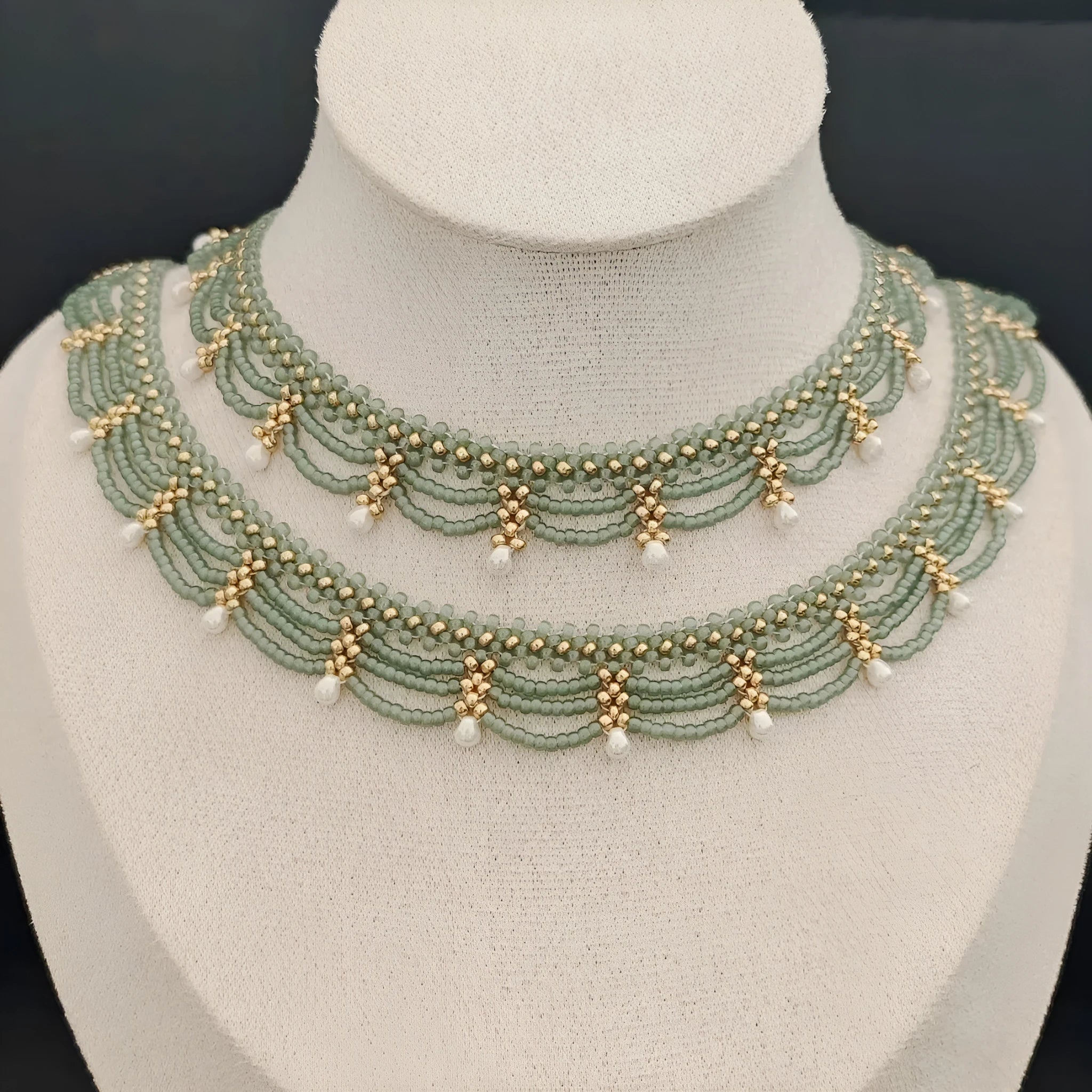 Retro style tassel water drop imitation pearl pendant necklace on display