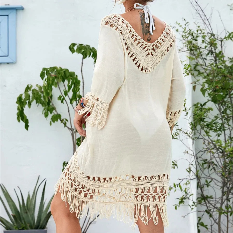 Apricot crocheted patchwork knitted dress with half sleeves on a person.